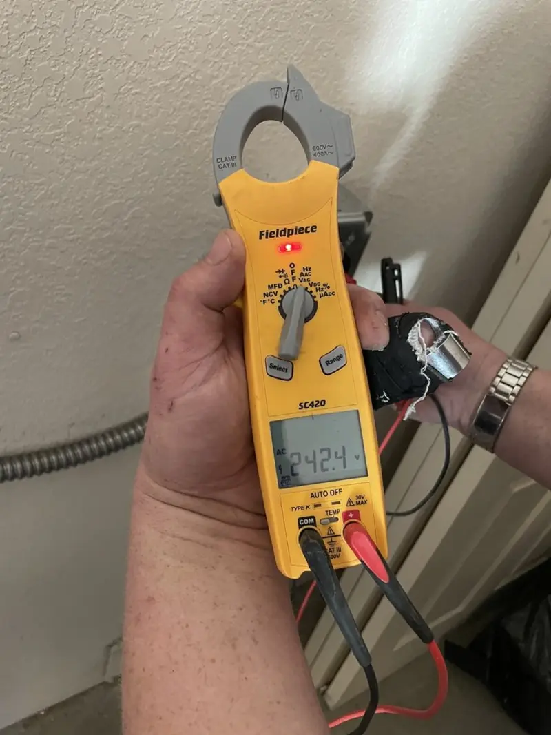 Voltage testing with clamp meter during Circuit Breaker Repair in Lexington